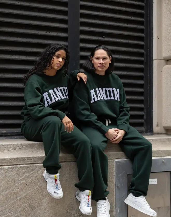 Two models wearing Aaniin branded sweatsuits, a Benjamin's Agency client